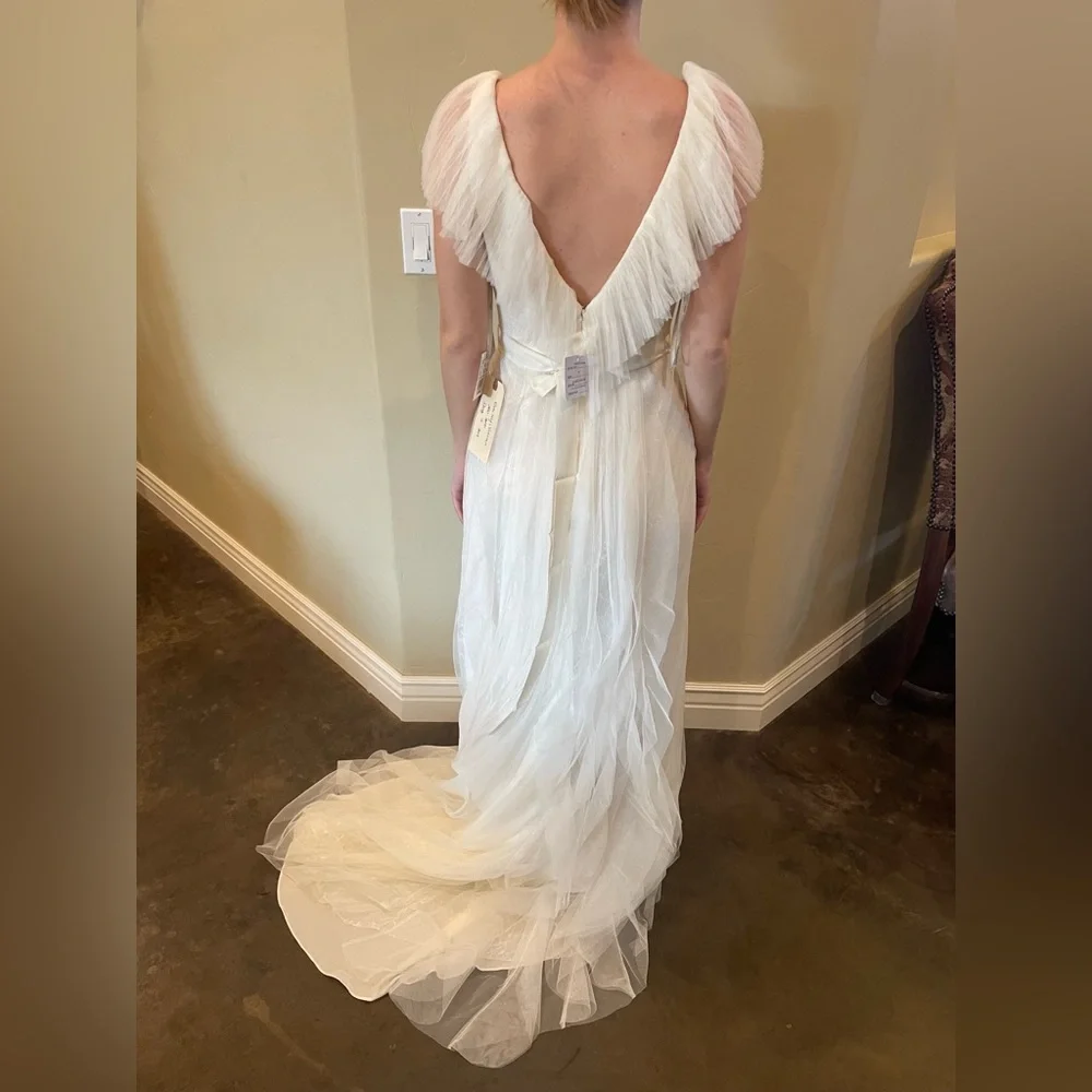 Beautiful Vera Wang wedding dress from David’s Bridal. Model is a size 0-2. - Picture 2 of 6